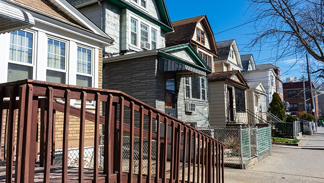 Row of diverse residential houses with different architectural styles.