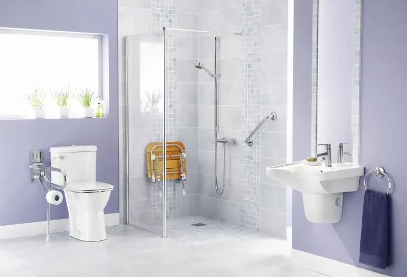 A step-in shower and bathroom equipped with safety and mobility items.