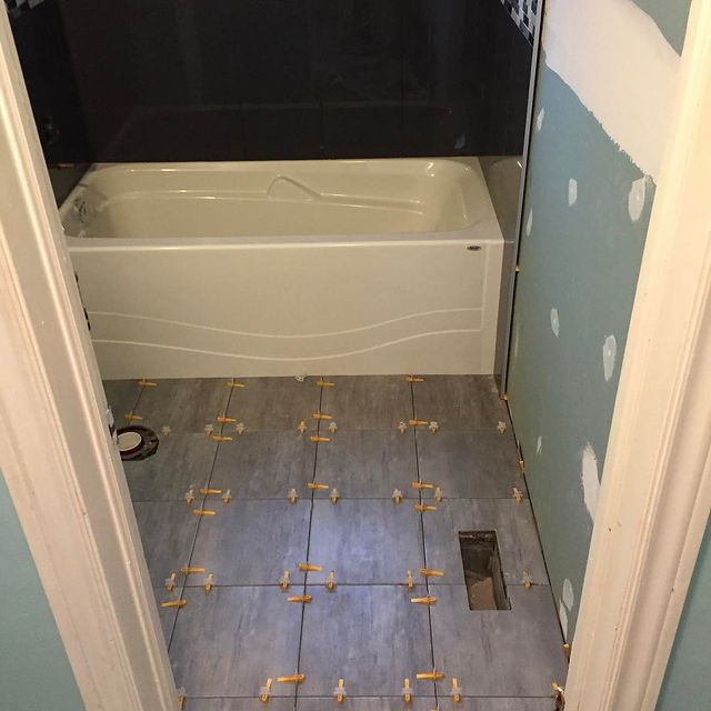 In progress bathroom tile installation